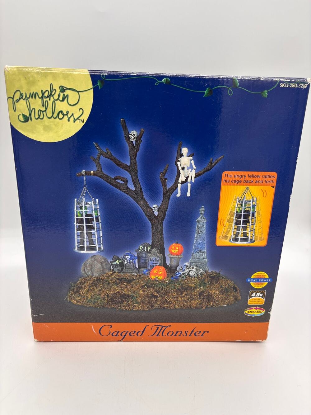 Retired Lemex Pumpkin Hollow cage monster animated lighted featuring a graveyard